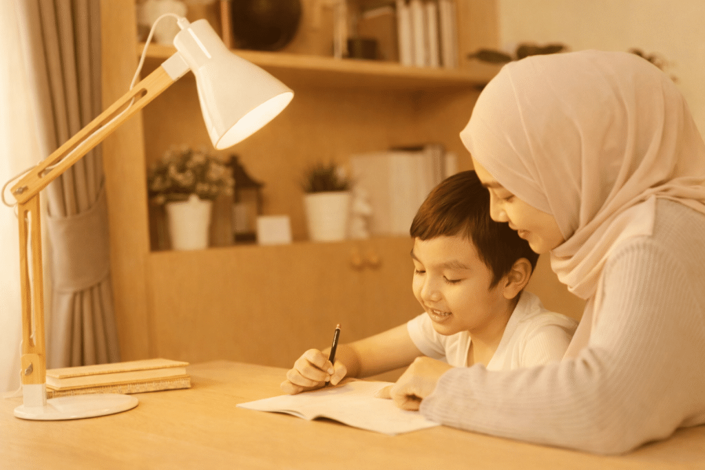 Muslim mother helping her child learn Arabic at home in a calm and nurturing environment